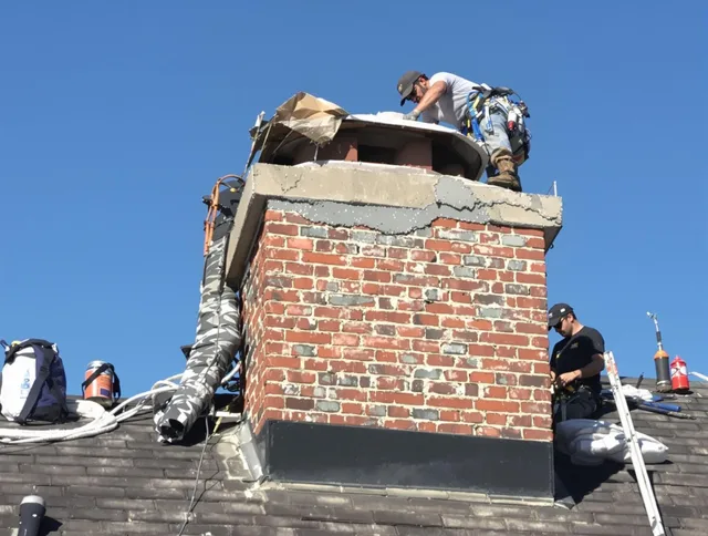 Rocky Hill Chimney Sweep installing a custom chimney crown in Rocky Hill, CT