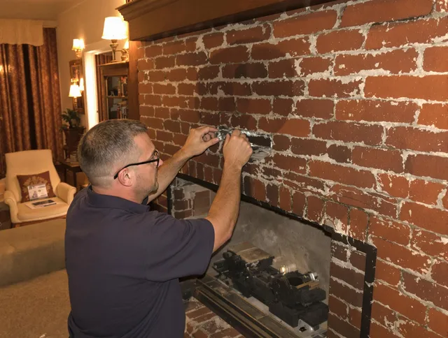 Rocky Hill Chimney Sweep expert fixing a fireplace in Rocky Hill, CT